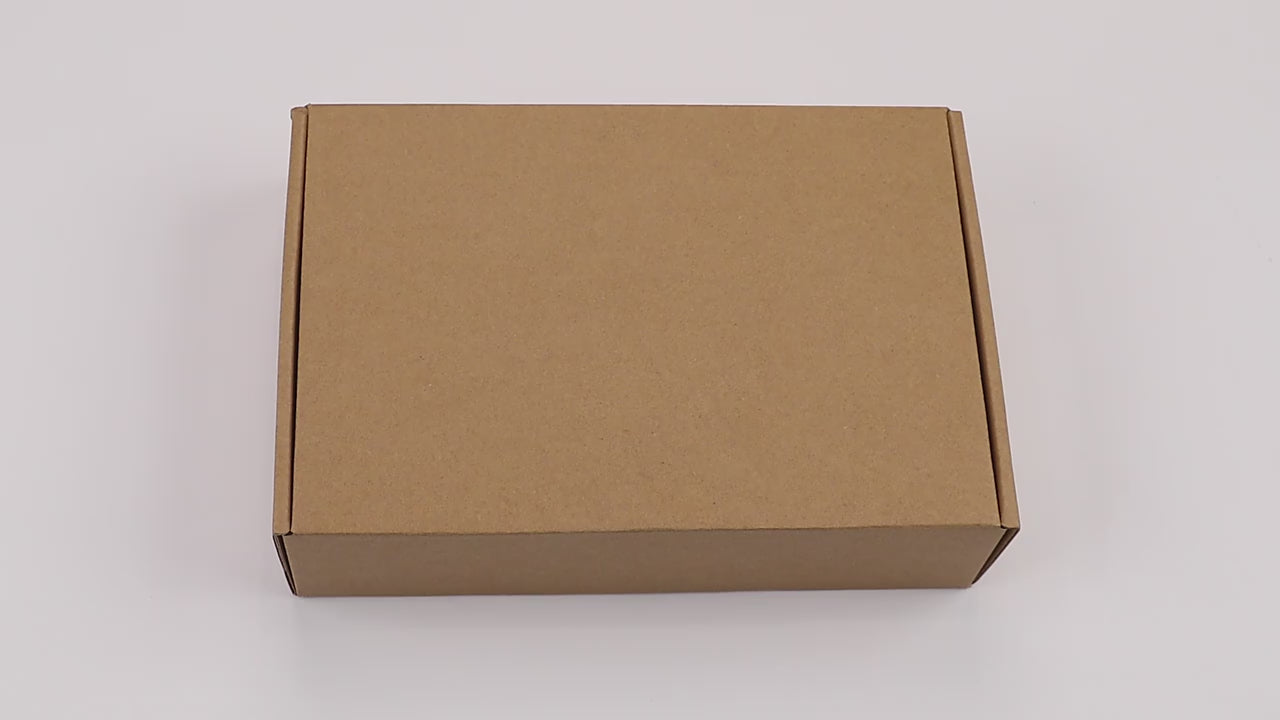 Unboxing video revealing Magic Copybook package contents including educational books, pens, and refills.